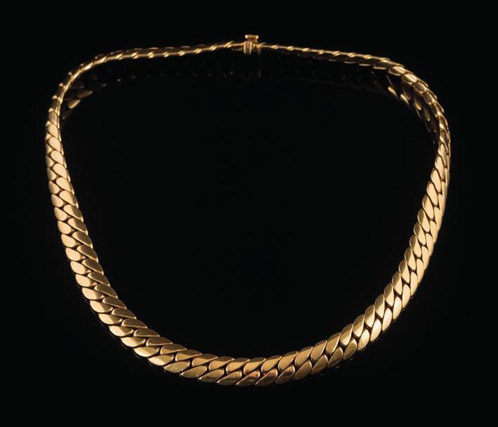 A curb-link necklace signed Cartier 750 and numbered 618392, the