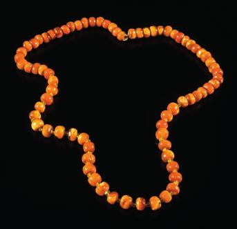 456 An amber bead single-string necklace with irregular beads on bolt ring clasp, 72cm total length, 54.5gms gross weight.