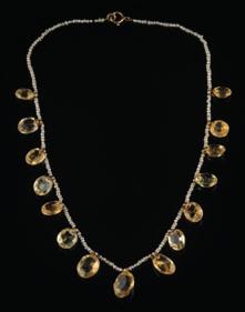 466 A graduated citrine and seed pearl fringe necklace, 10gms gross weight.