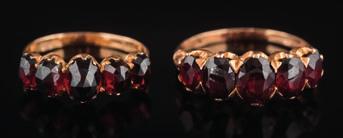 * 1000-1500 493 A gold and garnet, five-stone ring with graduated, oval-cut garnets, 3gms gross weight, ring size