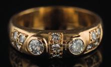 * 450-500 511 An 18ct gold and diamond thirteenstone ring with two circular, brilliant-cut diamonds between