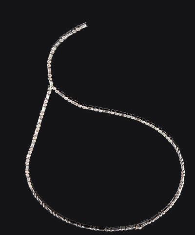 22 Lyon & Turnbull 53 A contemporary diamond set necklace composed of rectangular and circular polished links, half are set with alternating baguette cut diamonds and pairs of round brilliant cut