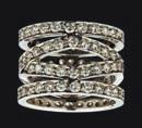 cut diamond in a double border of small round cut diamonds, suspending a curved twisted detail similarly set with small round brilliant cut diamonds, to post and clip