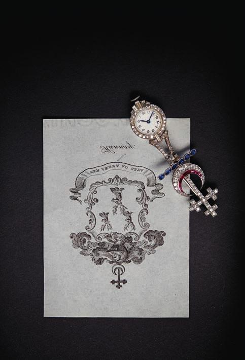 Select Jewellery & Watches 73 205 An early 20th century diamond set pendant watch modelled as the arms for the Hannay family, set throughout with graduated round and eight cut diamonds, channel set