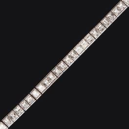 Select Jewellery & Watches 81 227 A diamond set line bracelet set with a single row of sixty-six princess cut diamonds, set in 18ct white gold, with a concealed clasp and safety clip Length: 19cm,