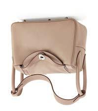 Handbags 236 MADLER - A mid-20th century travel bag modelled in a burgundy leather, with brushed brass