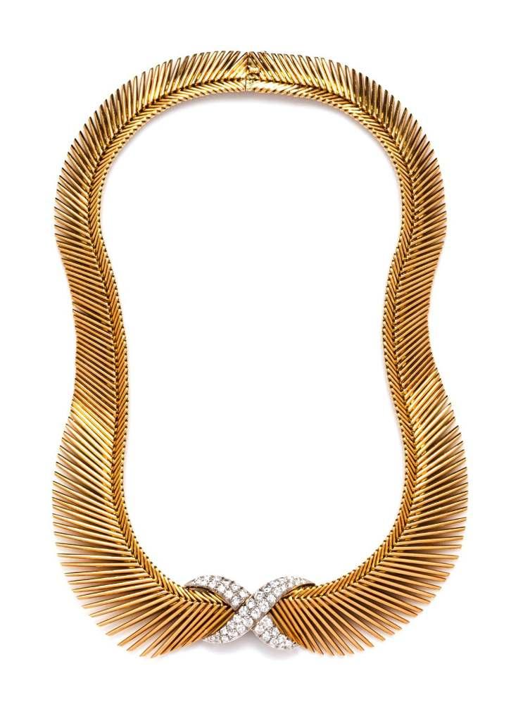 Sale 394 Lot 152 An 18 Karat Yellow Gold, Platinum and Diamond Cheveux d'ange Necklace, Van Cleef & Arpels, France, Circa 1955, consisting of a herringbone style necklace with tapered fringe