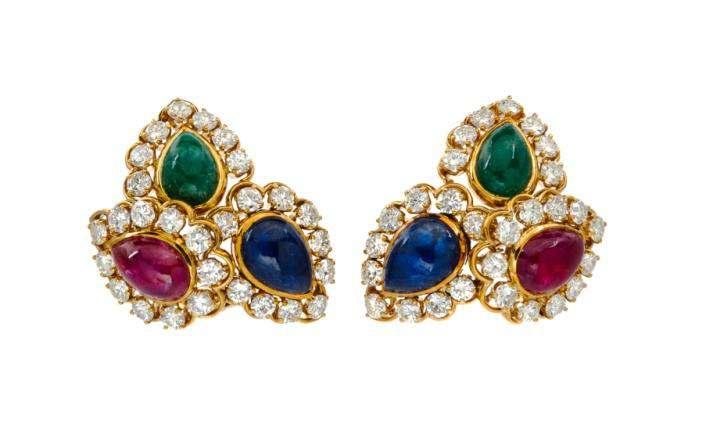 Sale 421 Lot 224 A Pair of Vintage 18 Karat Yellow Gold, Sapphire, Emerald, Ruby and Diamond Earclips, Van Cleef & Arpels, containing two pear shape cabochon cut sapphires measuring approximately 12.