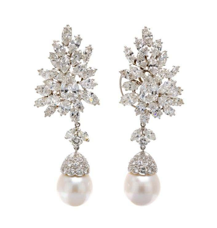 Sale 421 Lot 187 A Pair of Platinum and Diamond Spray Earclips, Van Cleef & Arpels, with Detachable Cultured Pearl and Diamond Drops, consisting of cluster settings containing two pear shape diamonds