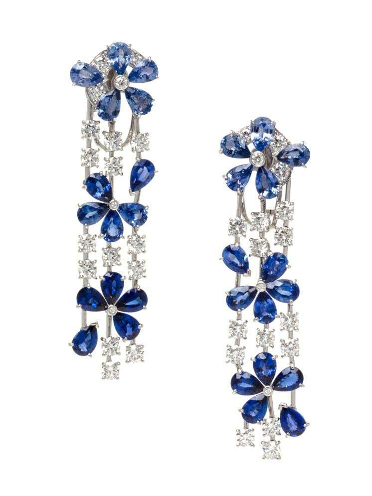 Sale 394 Lot 511 A Pair of 18 Karat White Gold, Sapphire and Diamond Fil de l Eau Earclips, Van Cleef & Arpels, Circa 2009, in a stylized floral motif, composed of cluster tops supporting triple
