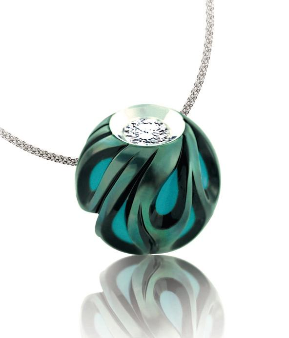 has two dedicated pearl carving factories in Soc Trang, Vietnam, and recently opened a Galatea Jewelry by Artist retail salon in Ho Chi Minh City. The Galatea Pearl with R.C turquoise center.