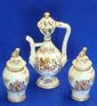 5cm diameter 39 A late 19th Century Samson porcelain armorial Ewer together with two further smaller baluster-shaped Vases and Covers gilded and decorated in Famille Rose enamels in the 18th Century