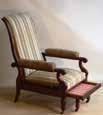 x 38cm (deep) 663 A William IV 19th Century mahogany Library Chair, circa 1835 with reclining back and pull out footrest on castors, probably by T.
