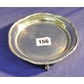 156. Cork silver circular salver or dish with raised border, and decorative wavy rim, on 3 claw on