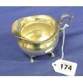 case 173. George V silver pierced mustard pot having hinged lid with finial 174.