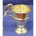 209. Edward VII silver vase shaped cup with scroll handle and body rim on a rising