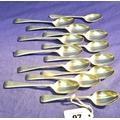 Set of four George V Sheffield silver coffee spoons with shaped decorated handles by James Deakin &