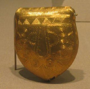 Example: Gold-Plated Bulla, Bog of Allen, Co. Kildare Form: Pendant-shaped Bulla 6.4cm long Decoration: Concentric circles, semi-circles, triangles and other patterns in repoussé.