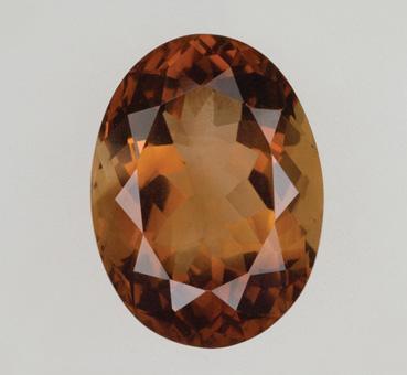 Figure 32. Some brown topaz currently on the market is not color stable. Both of these samples were the same orangy brown color when purchased. While the stone on the left (22.