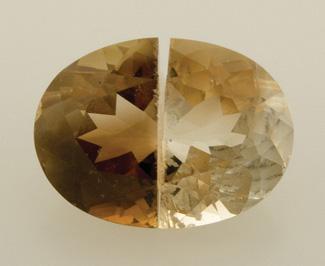Allen Brown (All That Glitters, Methuen, Massachusetts). To observe the effect of light on this material first-hand, GIA purchased four faceted orangy brown topaz samples (19.18 21.29 ct) from Mr.