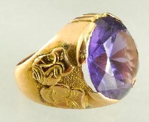 $750 - $1,000 460 14K yellow gold and sapphire ring. 461 Gemstone globe on stand.