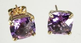 bracelet. Lot # 572 572 573 574 575 576 577 578 579 580 581 582 Pair of Tiffany & Co. sterling silver and amethyst stud earrings, w. cons. appraisal. Ivory boar tusk pendant with gold coloured mounts.