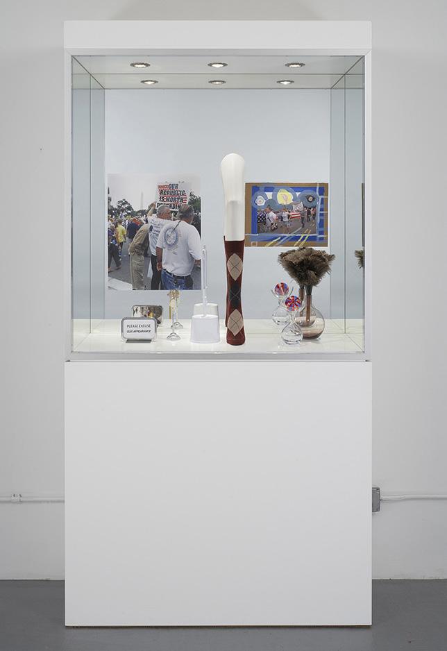 Josephine Meckseper I Love Jesus, 2005 Aluminium, plexiglass, glass, lights, c-print, metal display stands, plastic mannequin leg, argyle sock, found