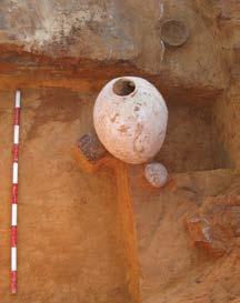 Upon manual excavation of this, five ceramic vessels were found in situ, including: two complete storage jars (damaged during area clearance), a cup, a bowl and a pinchedspout lamp (Fig. 108).