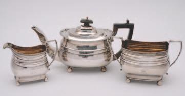 107 106 106 A matched George III three piece silver tea set, London, 1808/09, (maker s marks partially rubbed), each piece of oblong rounded form, gadrooned rims, angular
