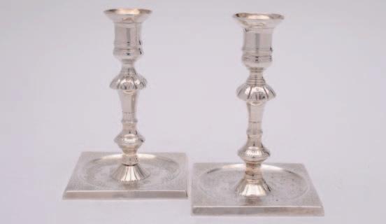 1200-1500 127 A matched pair of George II cast silver candlesticks, maker WI, probably James Wilks, London, 1752, and James Gould, London, 1754, with