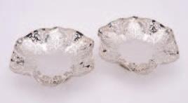 25 29 27 25 A pair of modern silver circular pierced dishes, maker R.