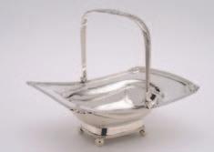 200-220 32 A late Victorian silver five bar toast rack, maker Deakin and Harrison, Birmingham, 1900, modelled as an elegant swan and supported on four ball feet, 13.5cm long, 5.25ozs.