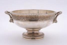 200-300 38 A George V silver two handled pedestal bowl maker Stewart Dawson & Co London, 1913, with pierced garland decoration to the rim, and stylized dolphin handles, 24.63ozs.