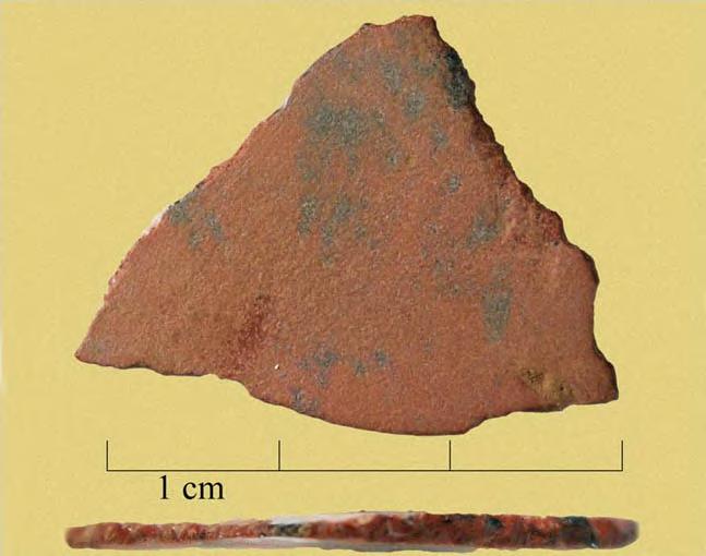 Figure 7i. Obsidian biface from the excavation unit in field 3 closest to the hill/pyramid. Photo by Karin Rebnegger and Chris Valvano. Figure 7j.