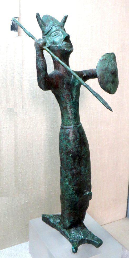 The "Copper" God, standing on an oxhide Copper ingot.