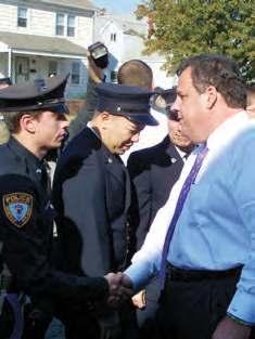 com SAYREVILLE - As Governor Chris Christie moved through the crowd, he stopped several times to thank those who helped during Superstorm Sandy. Pictured above are some of the police dept. and EMT s.