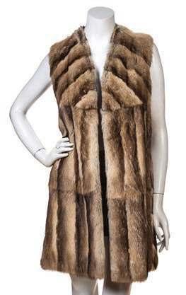 AUCTION HIGHLIGHTS 297 (1 of 2) 301 307 297* A Pair of Rabbit Fur Vests, one with two front slit pockets, open front, and interior silk lining and one with a lapel collar, two front slit pockets, and