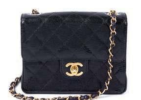 HANDBAGS 11* A Chanel Black Lizard Flap Handbag, with goldtone hardware, an exterior slip pocket, a logo turn clasp, a single chain shoulder strap, one interior zip pocket and one interior slip