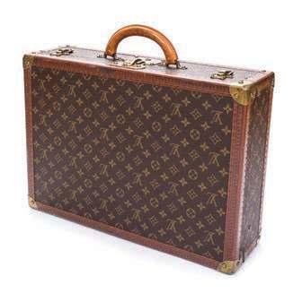 97 105 AUCTION HIGHLIGHTS 98 108 97* A Louis Vuitton Mini Handbag, with goldtone hardware, detachable wristlet