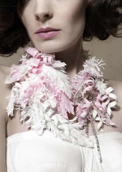 Karen McFarlane s evening collar is a fantasia of finely detailed feathers and curled ribbons all composed in pink and white Cashmere BT finished with faux diamonds.