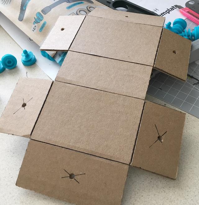 Flipping it over, you can mark center lines on the top and bottom sections that will be used to position the Circuit Playground Express and the arcade buttons.