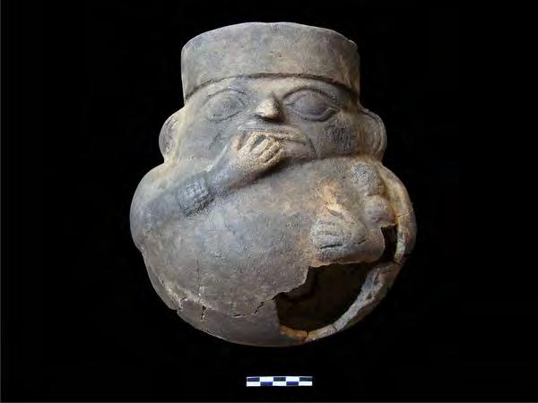 No Place for a Child? Dating to the late Moche period, between the seventh and eighth centuries A.D., a ceramic vase found during the recent Huaca Bandera excavation represents a female with a child in her left arm.