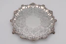 54 54 A Victorian silver salver, maker Hands & Sons, London, 1879, of shaped circular form, the centre engraved with foliate