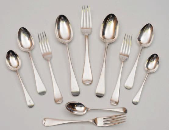 10 33 An extensive matched Old English pattern silver flatware service, various makers and dates, includes eight tablespoons, twenty four