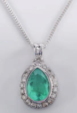 149A 151 151 An emerald and diamond mounted pearshaped pendant with central pear-shaped emerald approximately 14.