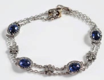 152 153 154 152 A sapphire and diamond bracelet with four oval clusters each with a