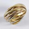 Lot: 89 Lot: 94 Ladies' Russian style wedding band, comprising seven intertwined bands in rose, yellow & white gold,