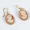 Lot: 49 Lot: 54 A pair of cameo drop earrings, comprising oval carved shells, approx.