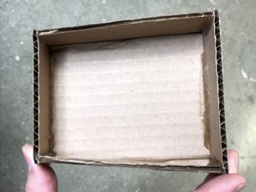 Glue cardboard strips along the top and bottom to hold the