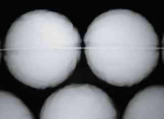 Figure 26. X-radiography revealed nacre thicknesses of only 0.3 0.6 mm in some of the engraved cultured pearls. Image by S. Singbamroong, Dubai Gemstone Laboratory. for an identification report.